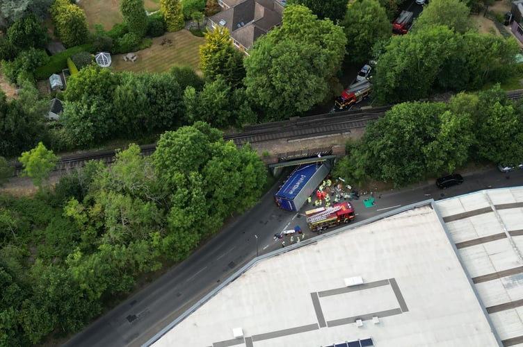Emergency services on the scene at the A325 Wrecclesham railway bridge after an HGV struck the bridge at around 6.15pm on Monday