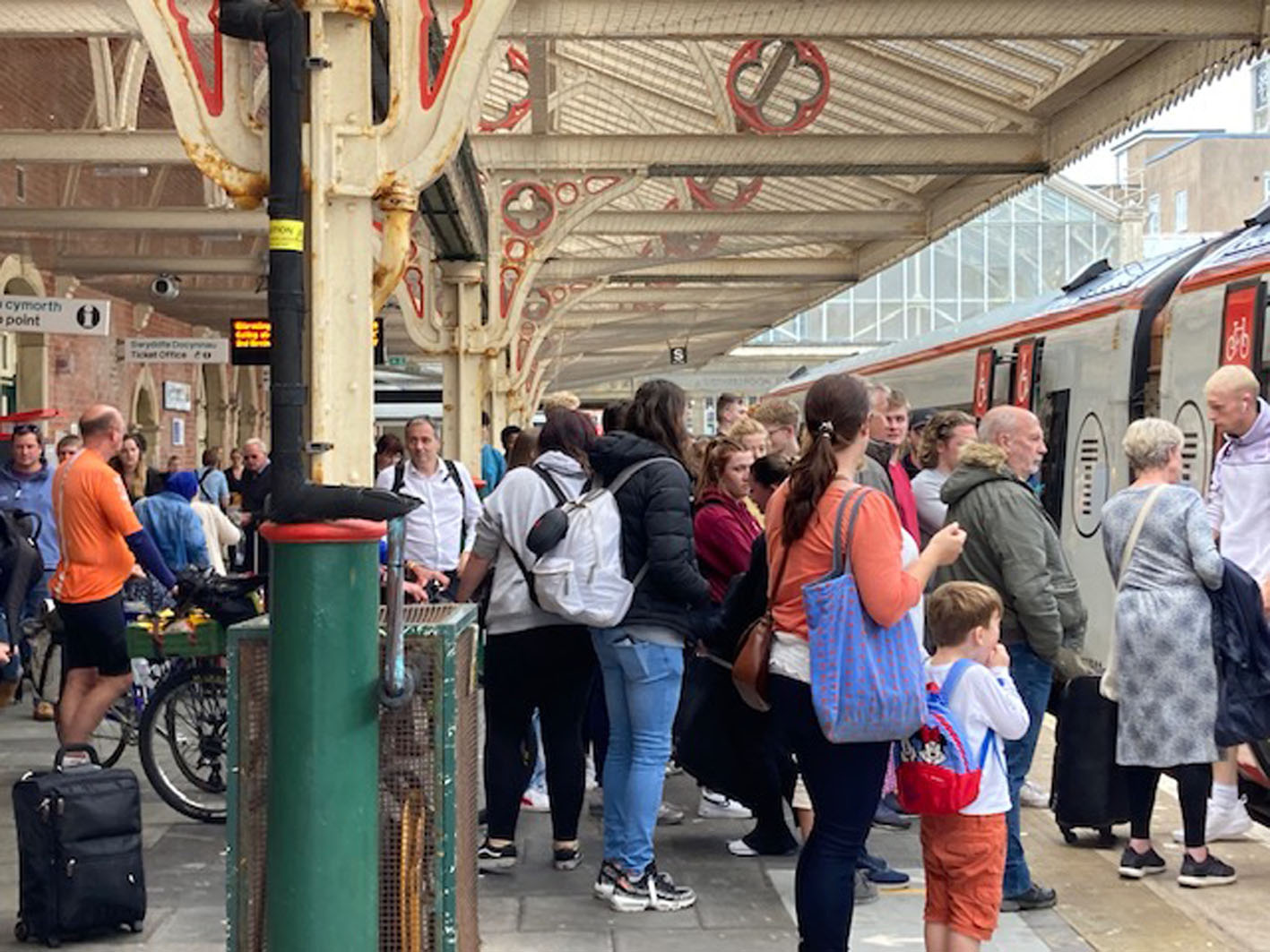 Crowded scenes as the 12.06 train from Birmingham International arrived in Aberystwyth on Friday, 1 July, with passengers trying to board the outbound two-carriage train