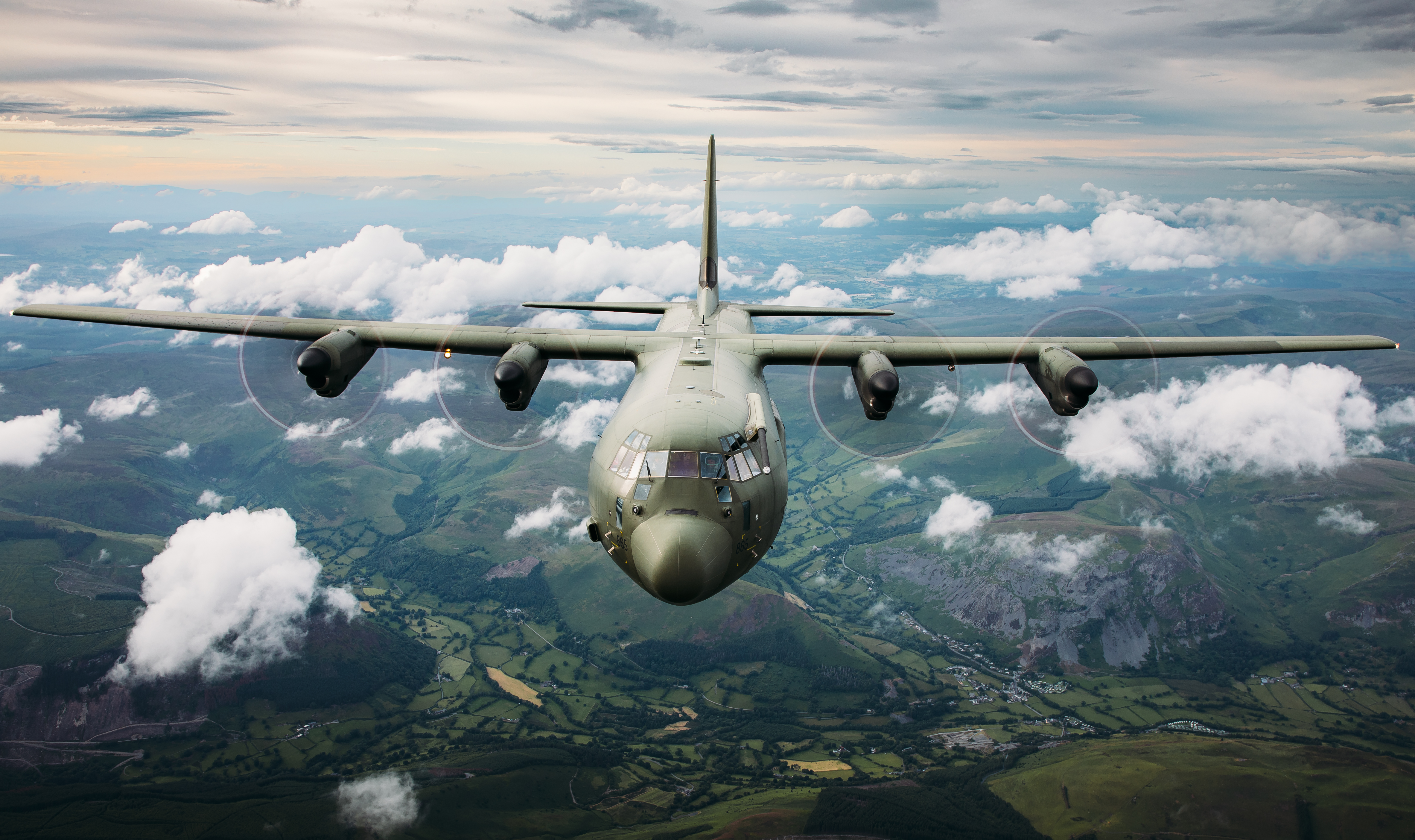 A C130 Hercules high in the sky above Snowdonia National Park