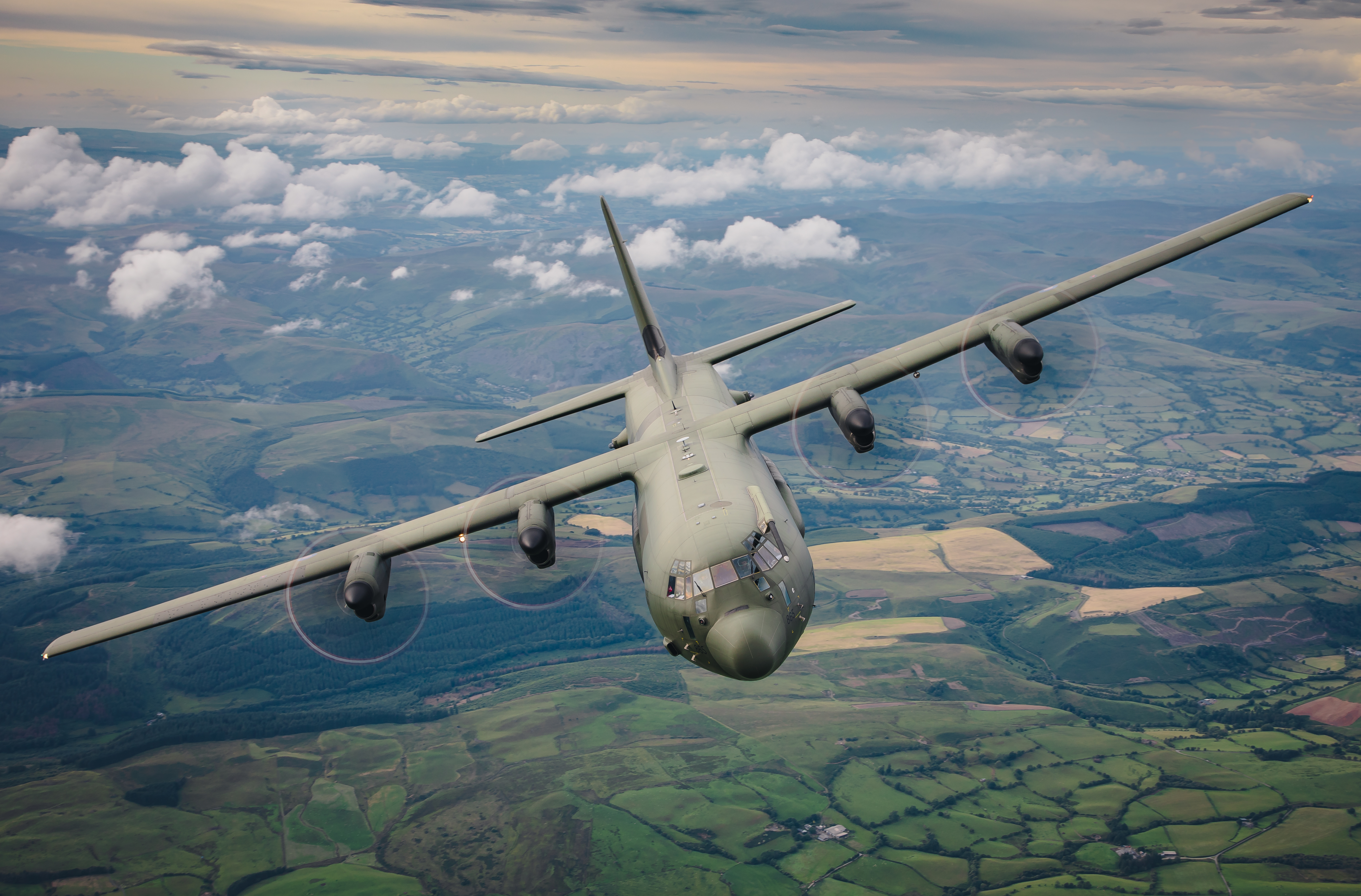 A C130 Hercules high in the sky above Snowdonia National Park