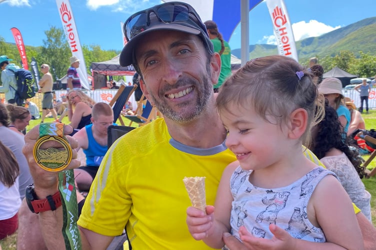 Ed Land celebrating with daughter Dorothea Aberystwyth Athletics Club 2022