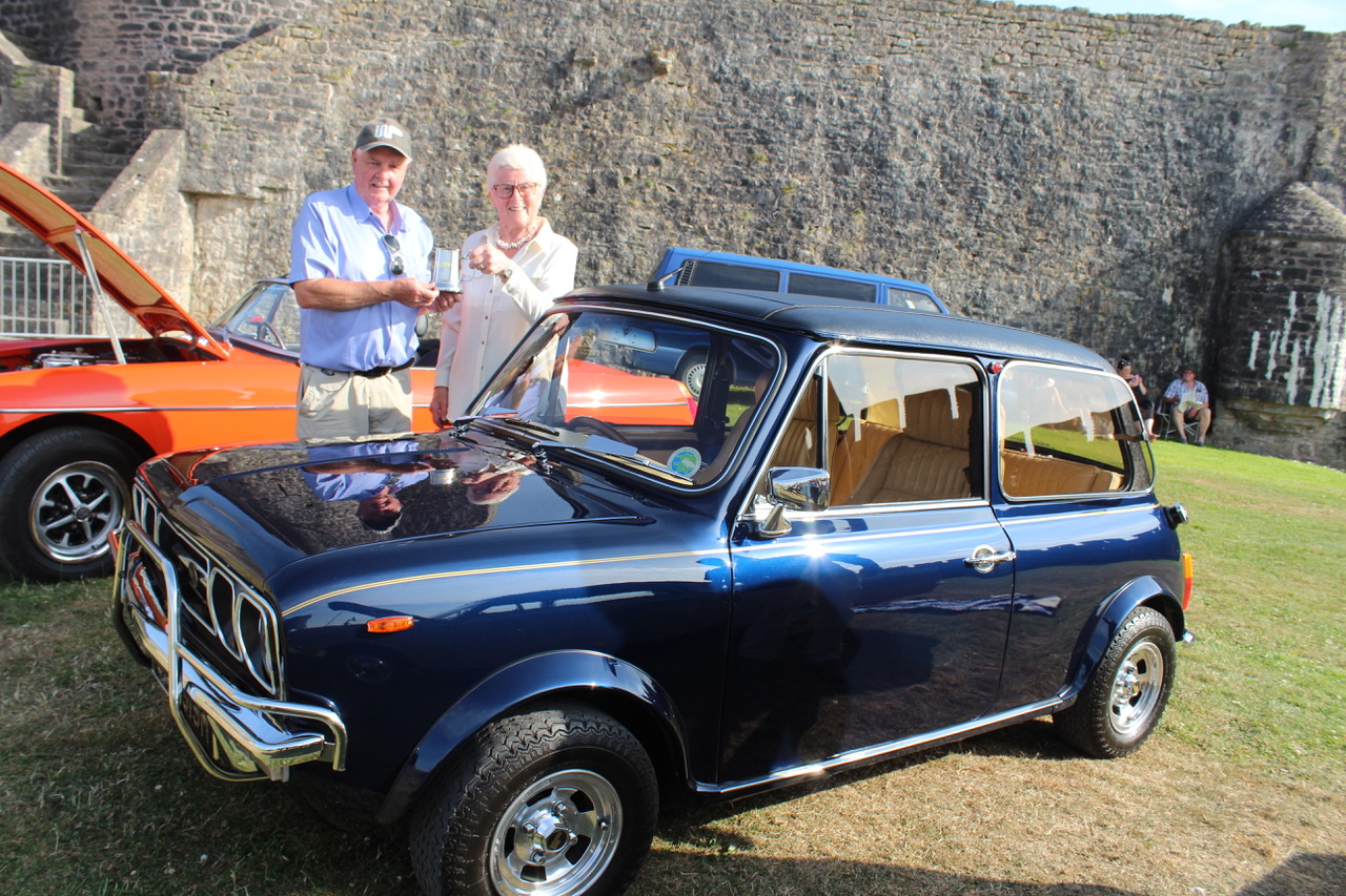 Roger Griffiths, of Sageston with Town Walls trustee Daphne Bush and a 1974 Mini Special.