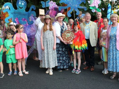 Mayor of West Devon Cllr Caroline Mott presents the winning trophy to St Peter’s and St Rumon’s primary schools for their Tavistock Carnival entry
