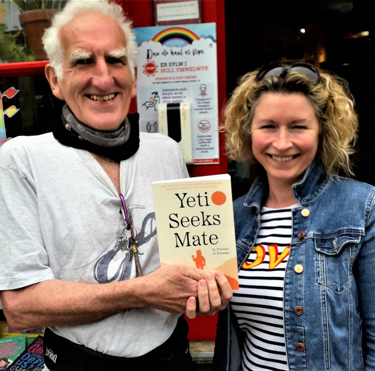 Mike presents Browsers Book Shop owner Sian Cowper with a personal Yeti copy