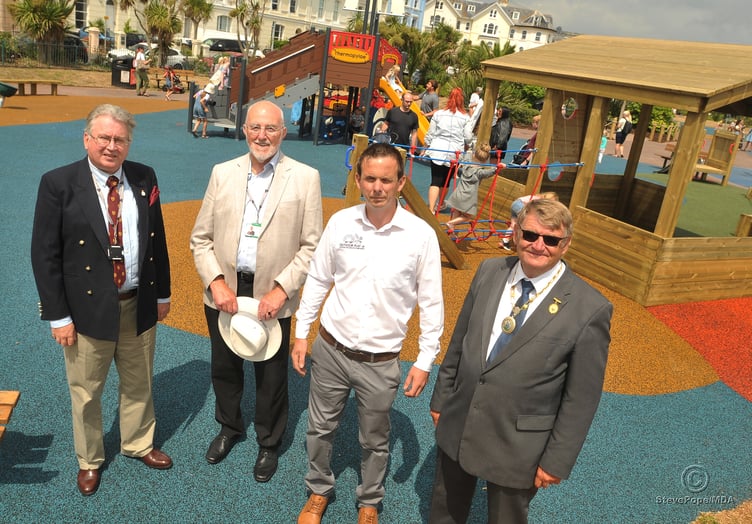 Children's playpark at The Den, Teignmouth, re-opens after refurbishment. Cllr David Cox, Clr John Nutley, Christopher Burley of Outdoor Play Devon Ltd and Cllr Chris Clarence prepare to officially open the play park