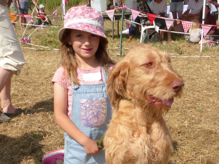 Winning the dog most like its owner category is Hattie with her pooch Winnie.