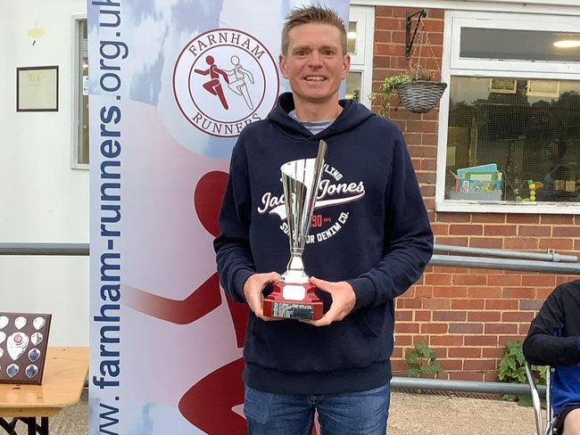 <p>James Clarke with his overall men’s trophy</p>