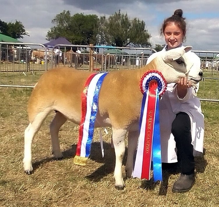 ABOVE: Taking home the coveted Supreme Champion Sheep, was a Texel Shearling Ewe, from MG and KJ Coumbe of Liskeard
RIGHT: Sue and Sam Tancock of Kelly Bray