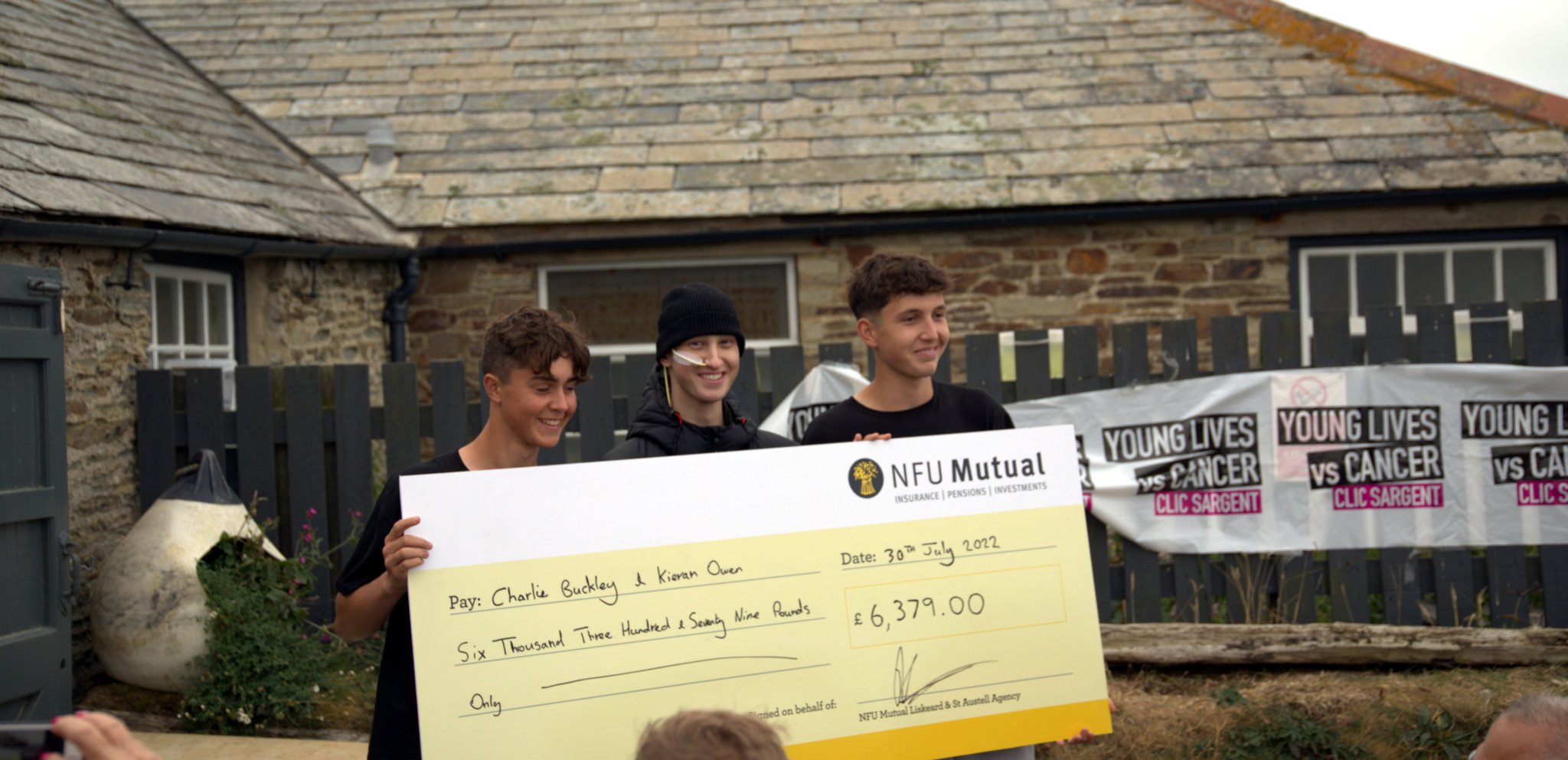 BARNEY (centre) Charlie and Kieran with the cheque for £6379 from NFU Mutual