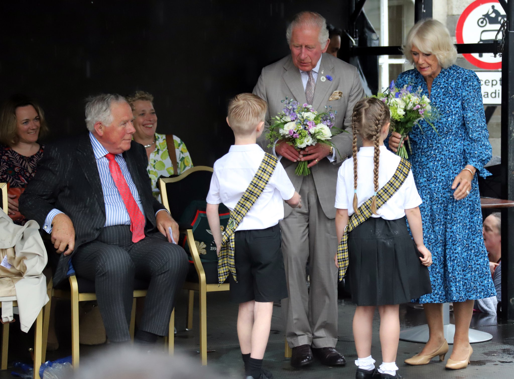 ABOVE: Camilla, Duchess of Cornwall
RIGHT: Their Royal Highnesses meeting Launceston Town Crier Rob Tremain.
Below: Prince Charles chatting with some of the youngsters of the town
Pictures: Mark Theisinger