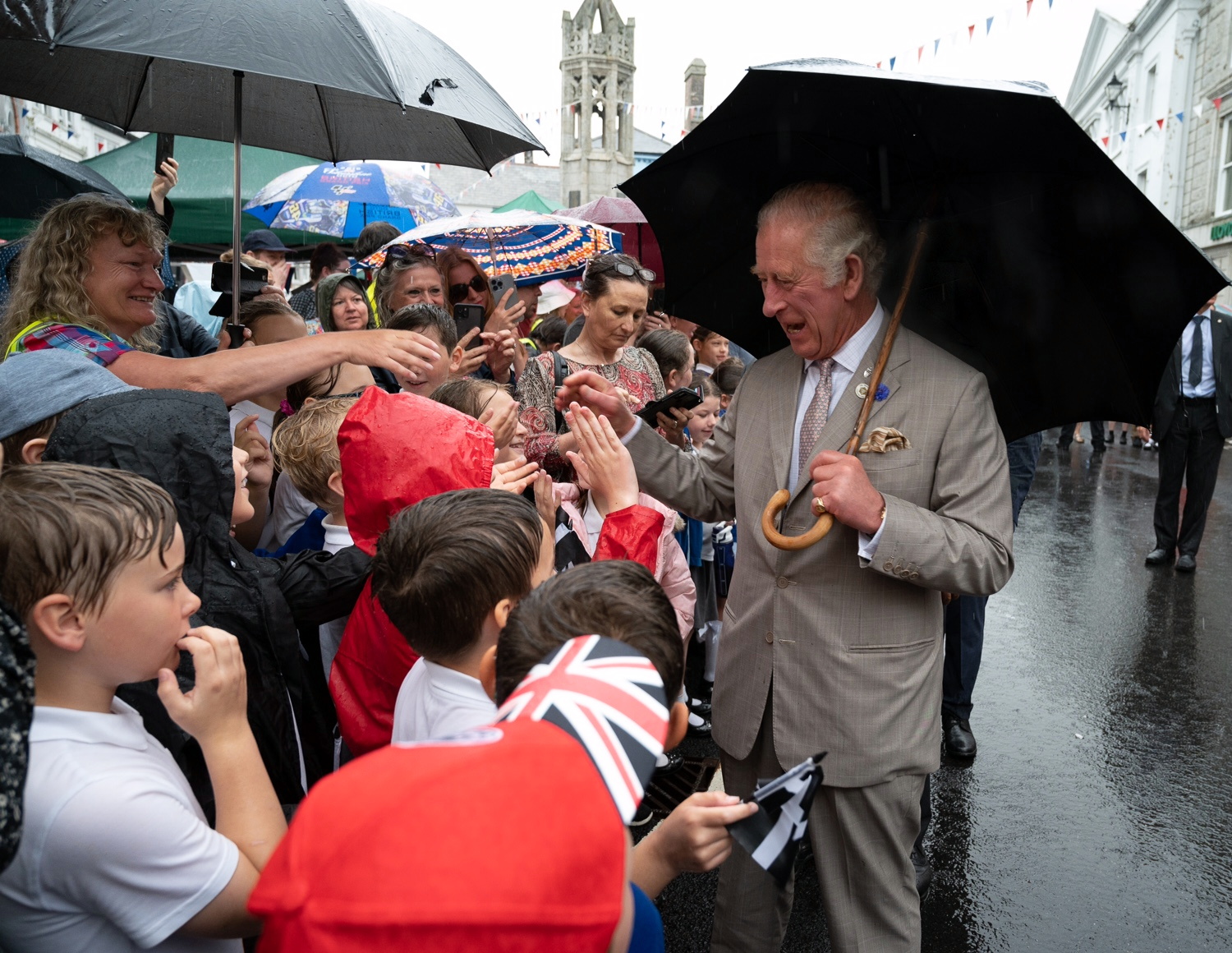 Their Royal Highnesses The Duke & Duchess of Cornwall visited Launceston today and toured the local market featuring Cornish products. The rain showers didn’t dampen the spirit of the locals who turned out to welcome them. Pic:Mark Theisinger