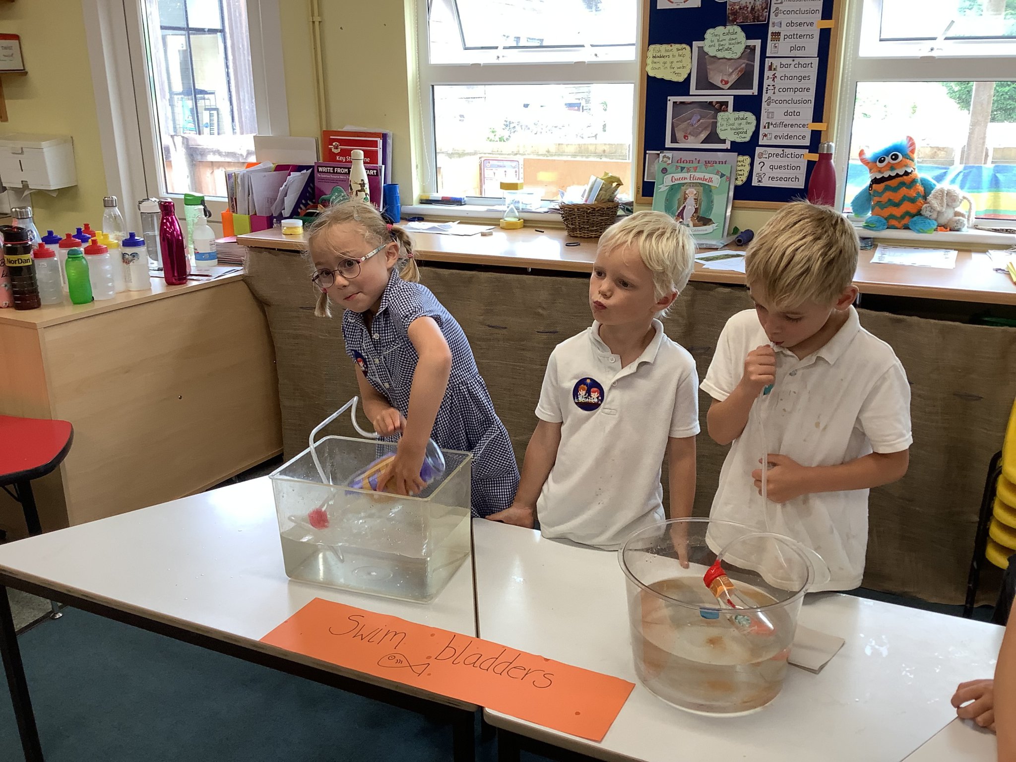 Dr Cooper, Mr Piper and Mr Adams from Launceston College finding out about Reception children’s work on density