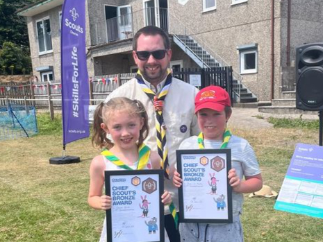 Ewen de Young, Cally Rice and Assistant District Commissioner Graham Coates at Buckfastleigh 1st Scouts' third birthday party.
Picture: Buckfastleigh 1st Scouts.