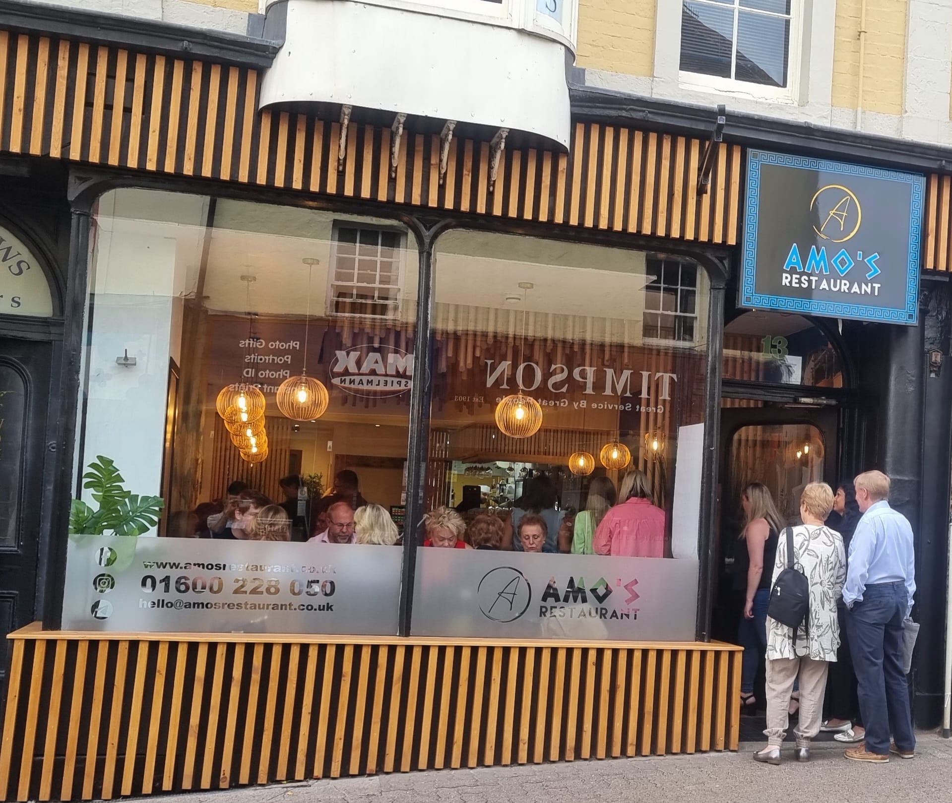 The restaurant above before the partners revamped the building and put the wooden panels on, right, which have now been removed