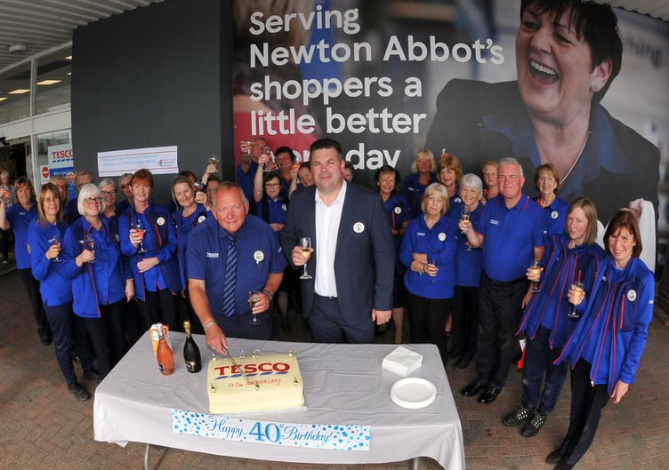 Photo: Steve Pope MDA030822B_SP003Tesco superstore in Kingsteignton celebrates its 40th anniversary Bakery manager Martin Doyle and store manager James Sanders cut the cake