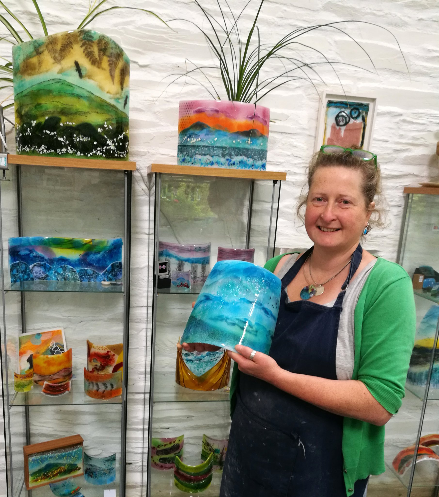 Moira Williams in her home studio where she works with glass and a kiln to create vibrant pieces