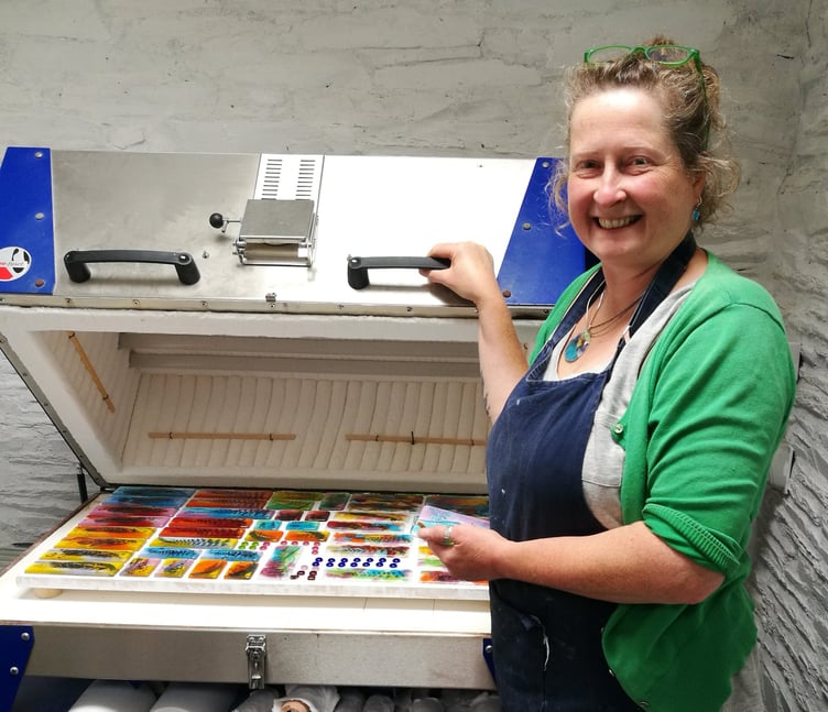 Moira Williams in her home studio where she works with glass and a kiln to create vibrant pieces