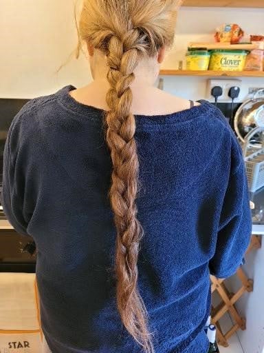 Sarah Jane Williams has shaved off her waist-length hair, as seen in before and after photos, right