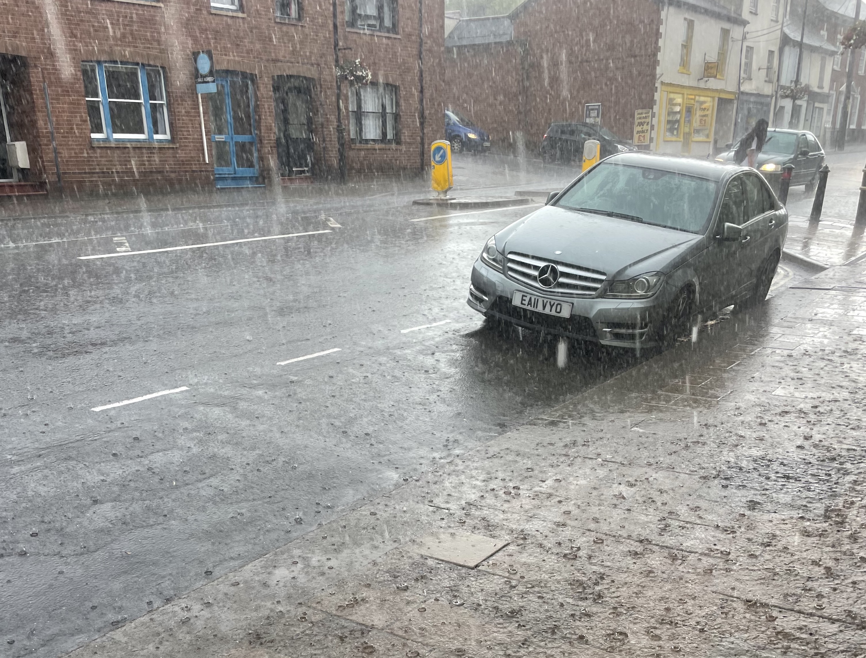 Flooded pavements in Crediton after the freak weather struck. AQ 3383