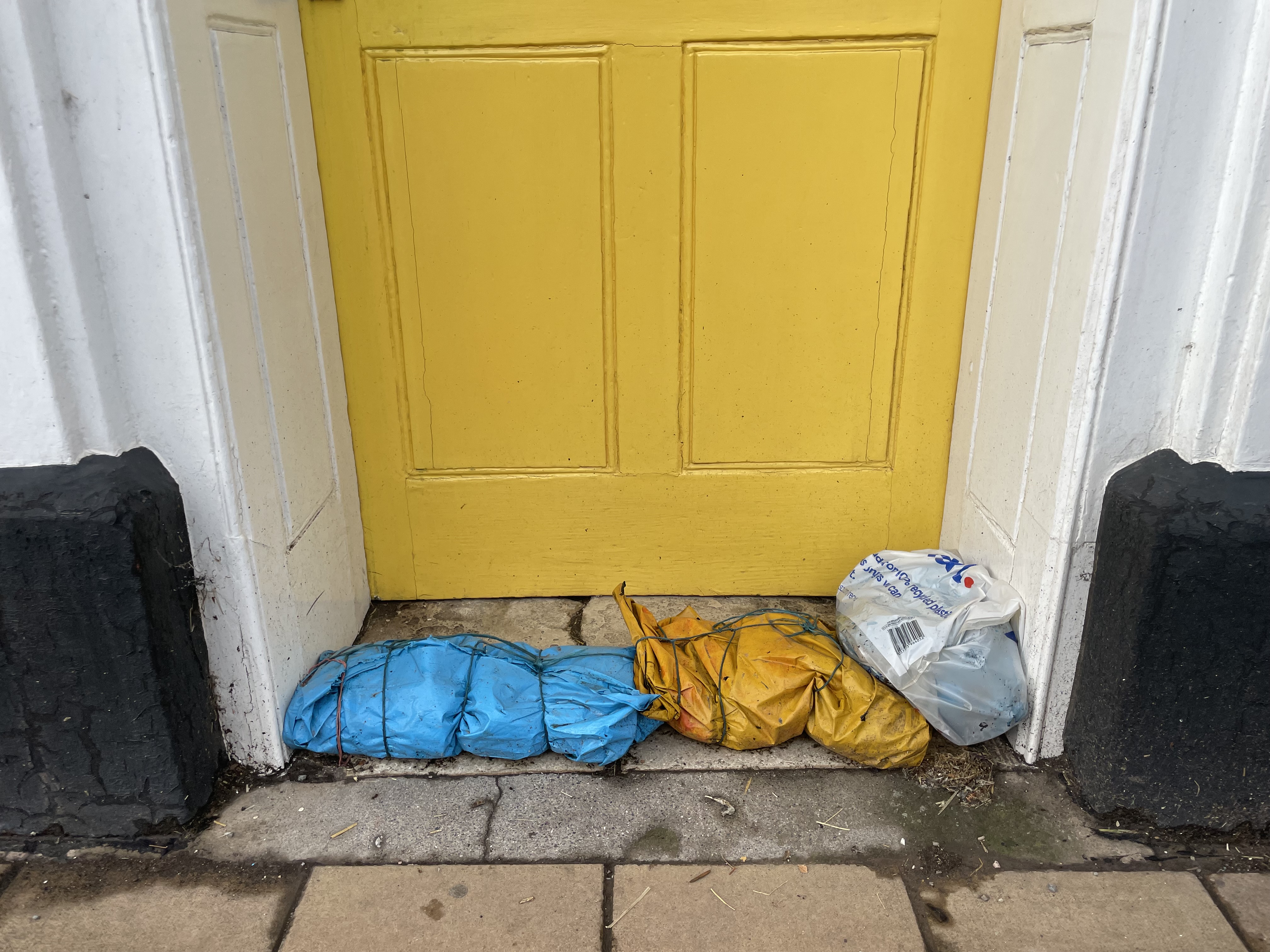 Sandbags outside one Crediton High Street office. AQ 3409