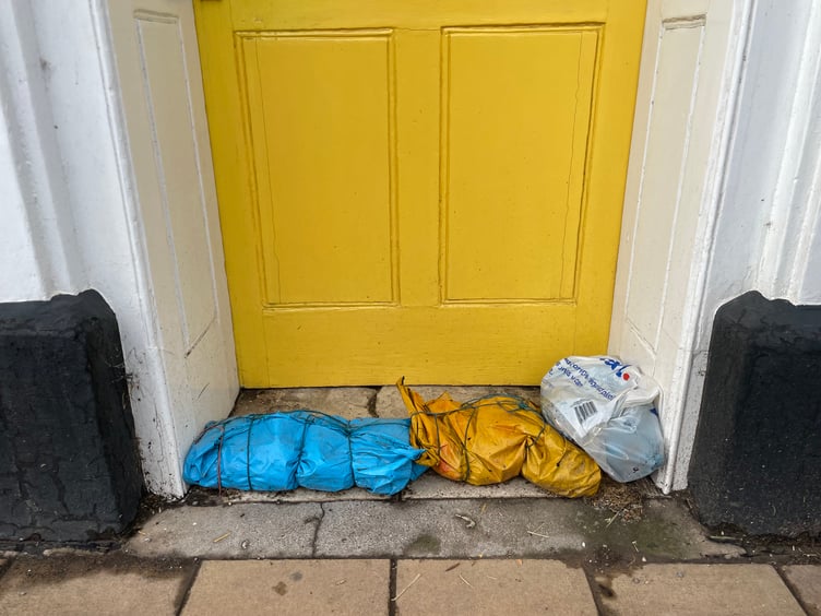 Sandbags outside one Crediton High Street office. AQ 3409