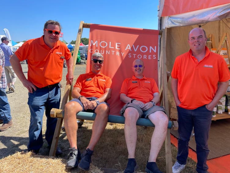 Some of the staff from the Mole Avon stand in a giant deckchair. AQ 8163