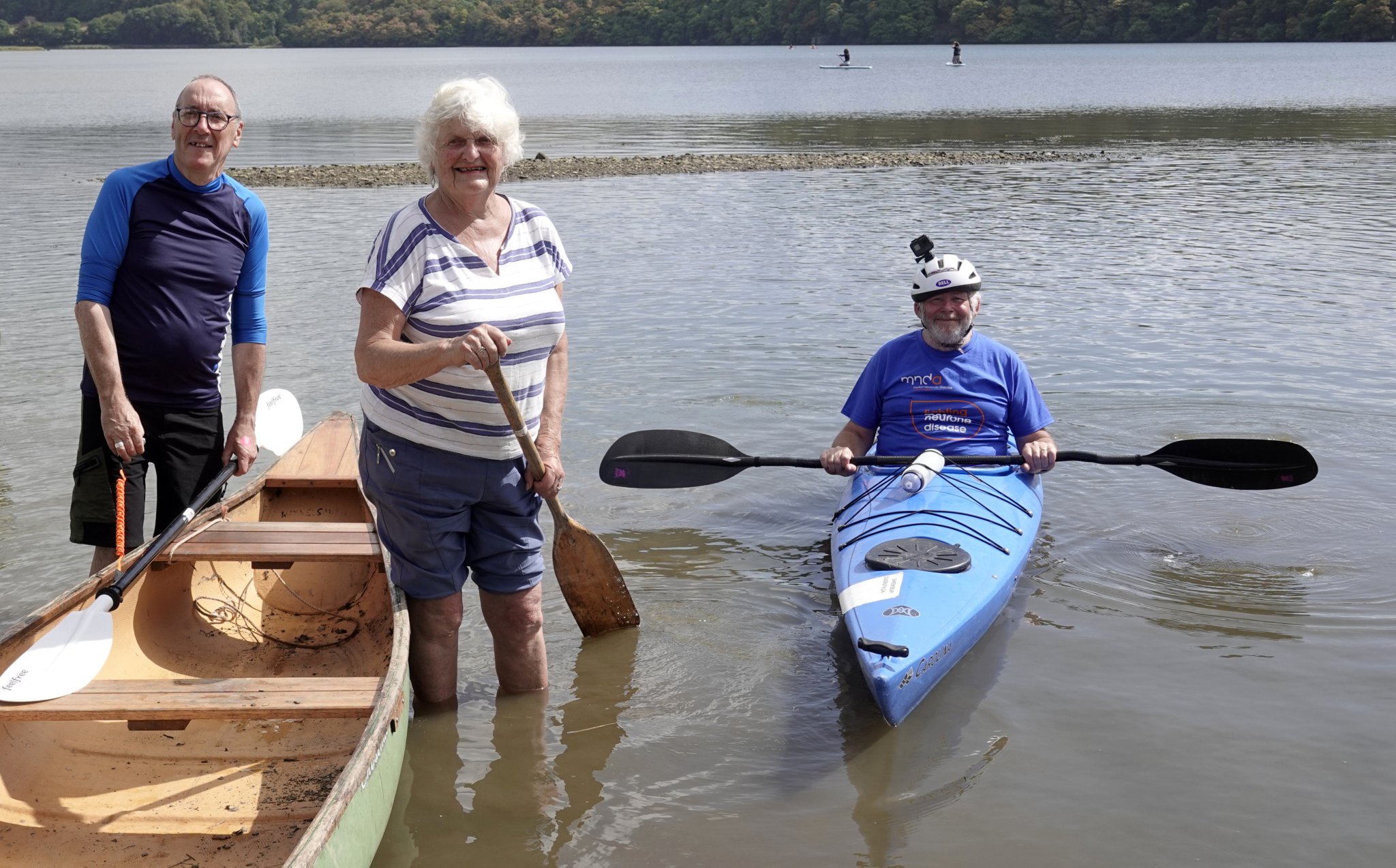 ABOVE: Four members of Team Rob, who had supported him and organised the fundraising event: Ann Jeffries, Angela Hooper, Jane Bull and Pat Moss. BELOW: Alistair Bates in his kayak, with two of the villagers who accompanied him in to the quay: Ann Jeffries and Marcel Kelly.