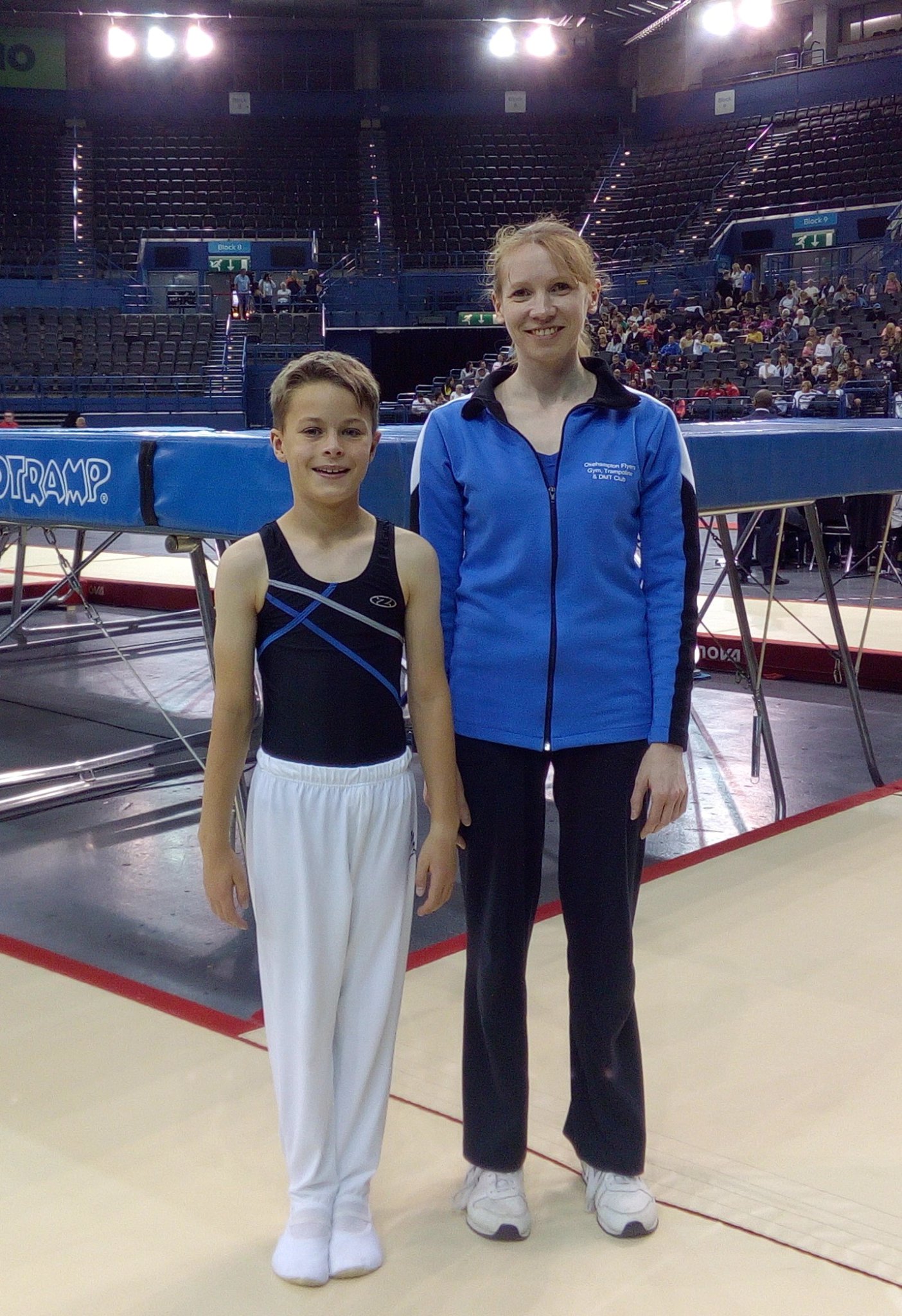 Mason Parker-Groves with head coach Vicki Prichard, and right, performing his routine.