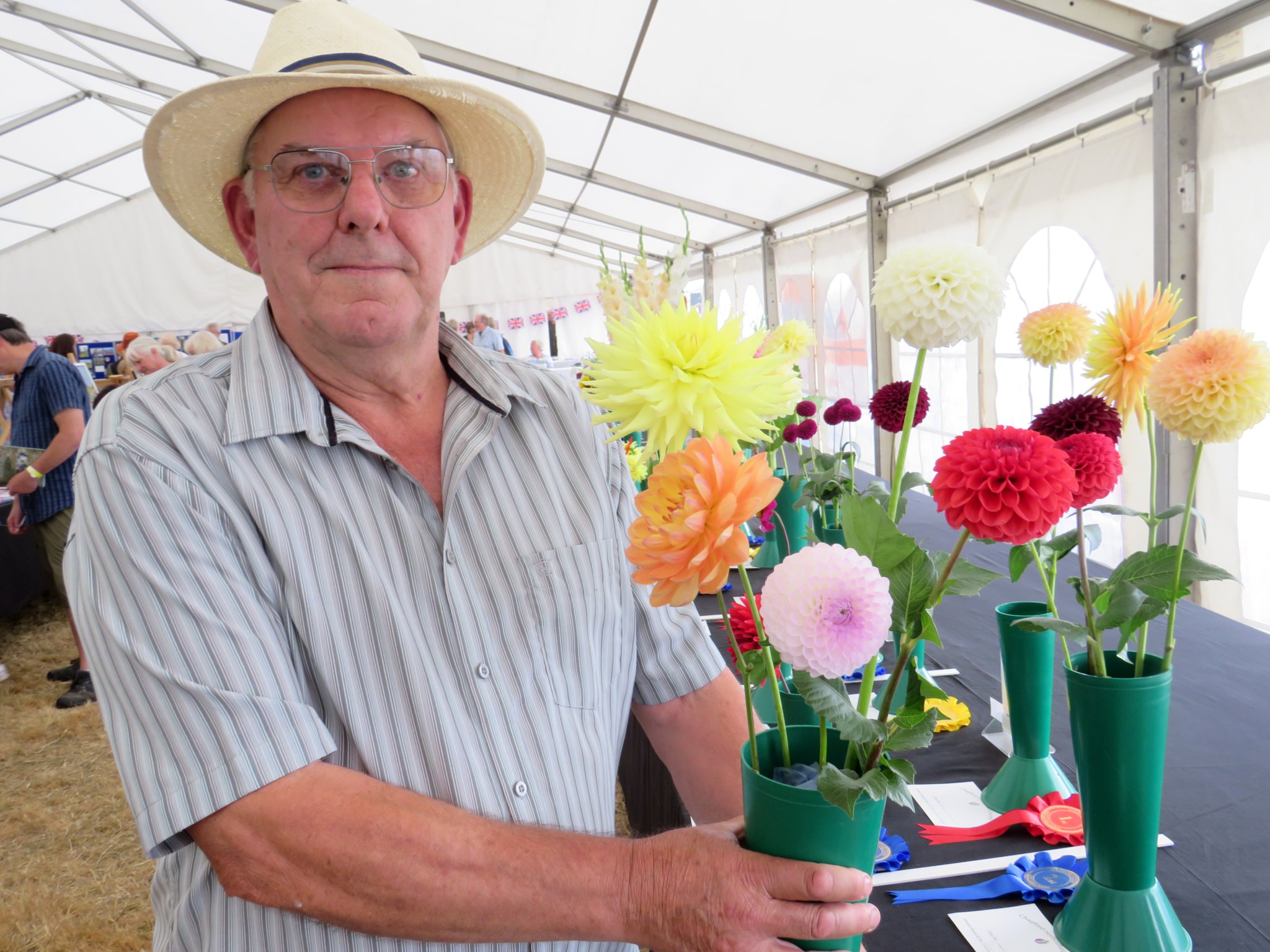 Roger Hutchings from South Brent with his prizewinning flowers. He won eight first prizes for his blooms with his pride and joy being his mixed dahlias