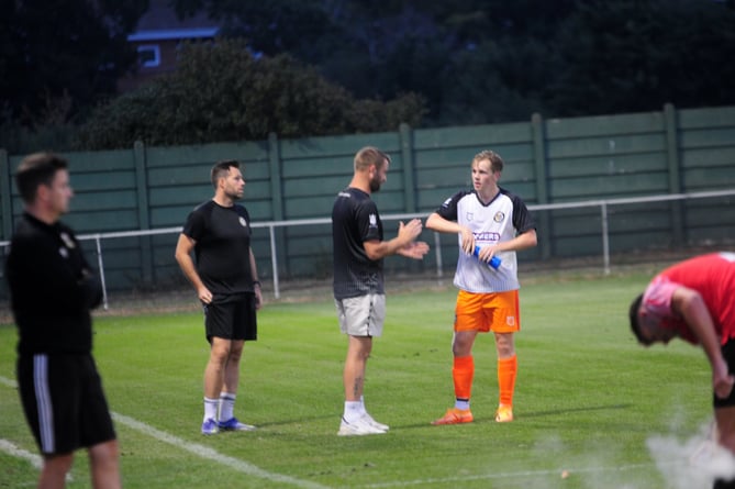 Alton manager Kevin Adair tries to get a point across during a break in play at Fareham Town