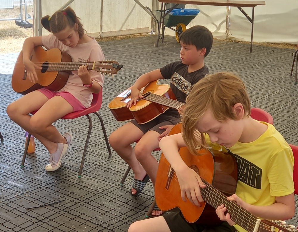 Have a go at playing a guitar with Stuart Toms.