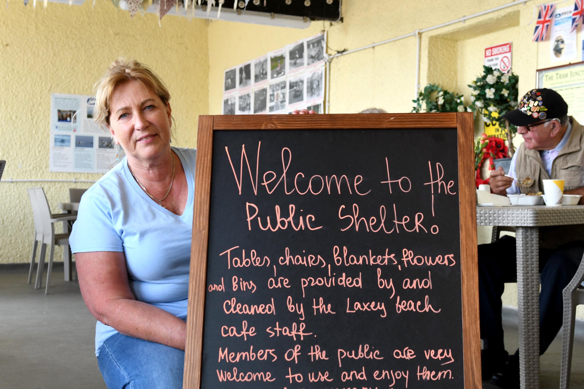 The Laxey Beach Cafe and the public shelters on Laxey Promenade - pictured is proprietor Julie Pinson