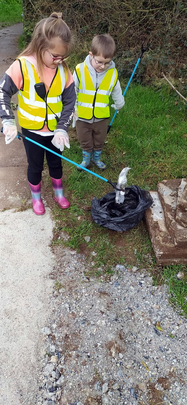 YOUNGSTERS doing their bit to keep their local park tidy in Liskeard
