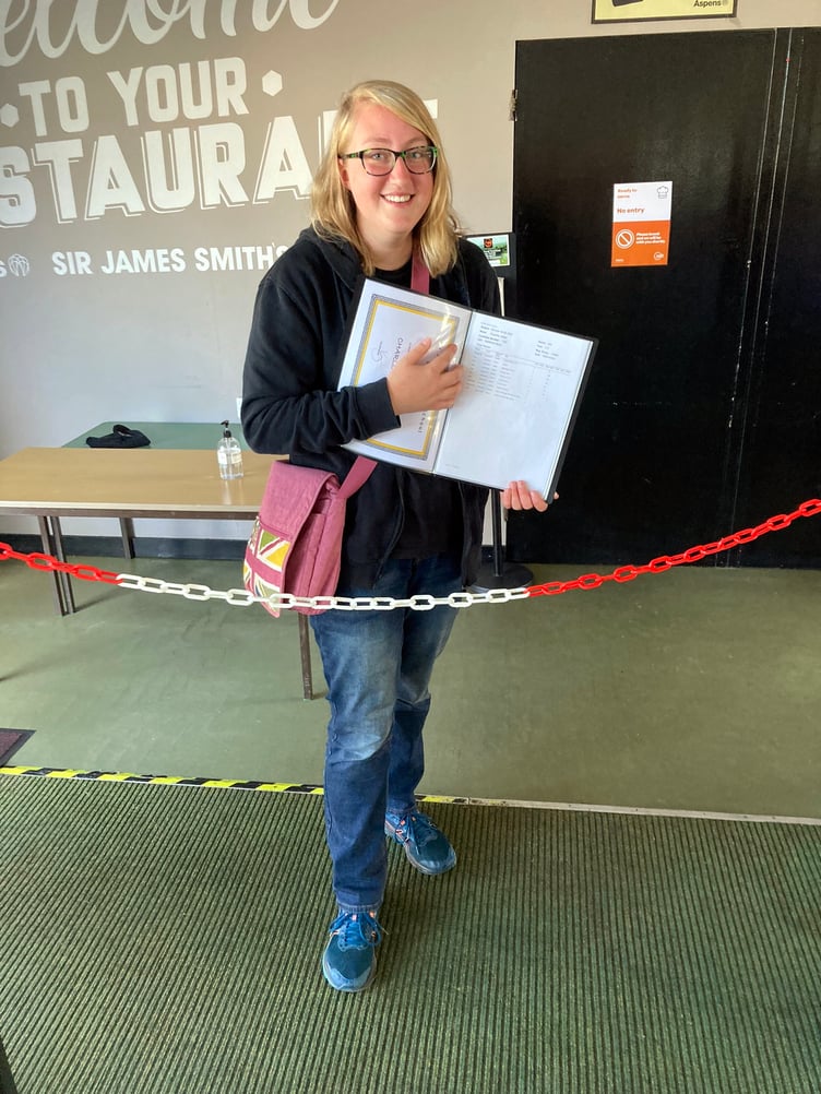 A student collecting their GCSE results at Sir James Smith's School, Camelford