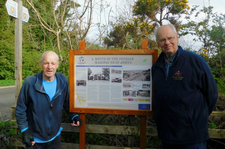 Paul Lemaire, chairman and founder of Foxdale Heritage, and Mike Buttell, the author of multiple interpretation boards, next to board four