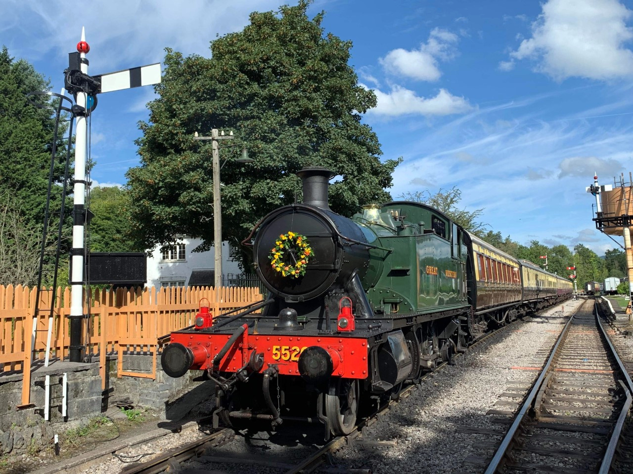 Nick as the driver on visiting locomotive 9466 during the SDR’s 50th anniversary celebrations in April 2019.. Inset: the foral tribute on an SDR locomotive.