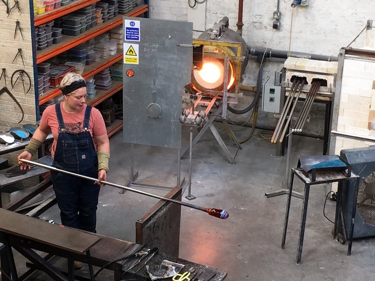 A Teign Valley Glass worker with one of the workshop’s ‘glory holes’.