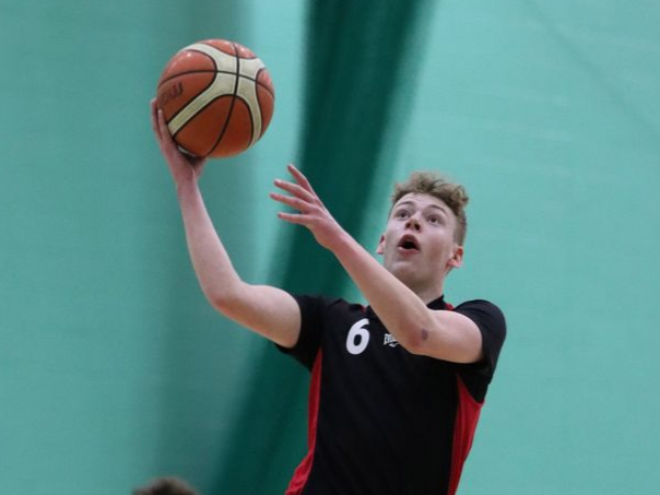 Ravens’ Vannin Coulter hits a lay-up during his side’s Senior League clash with Cavaliers on Thursday evening at the NSC
