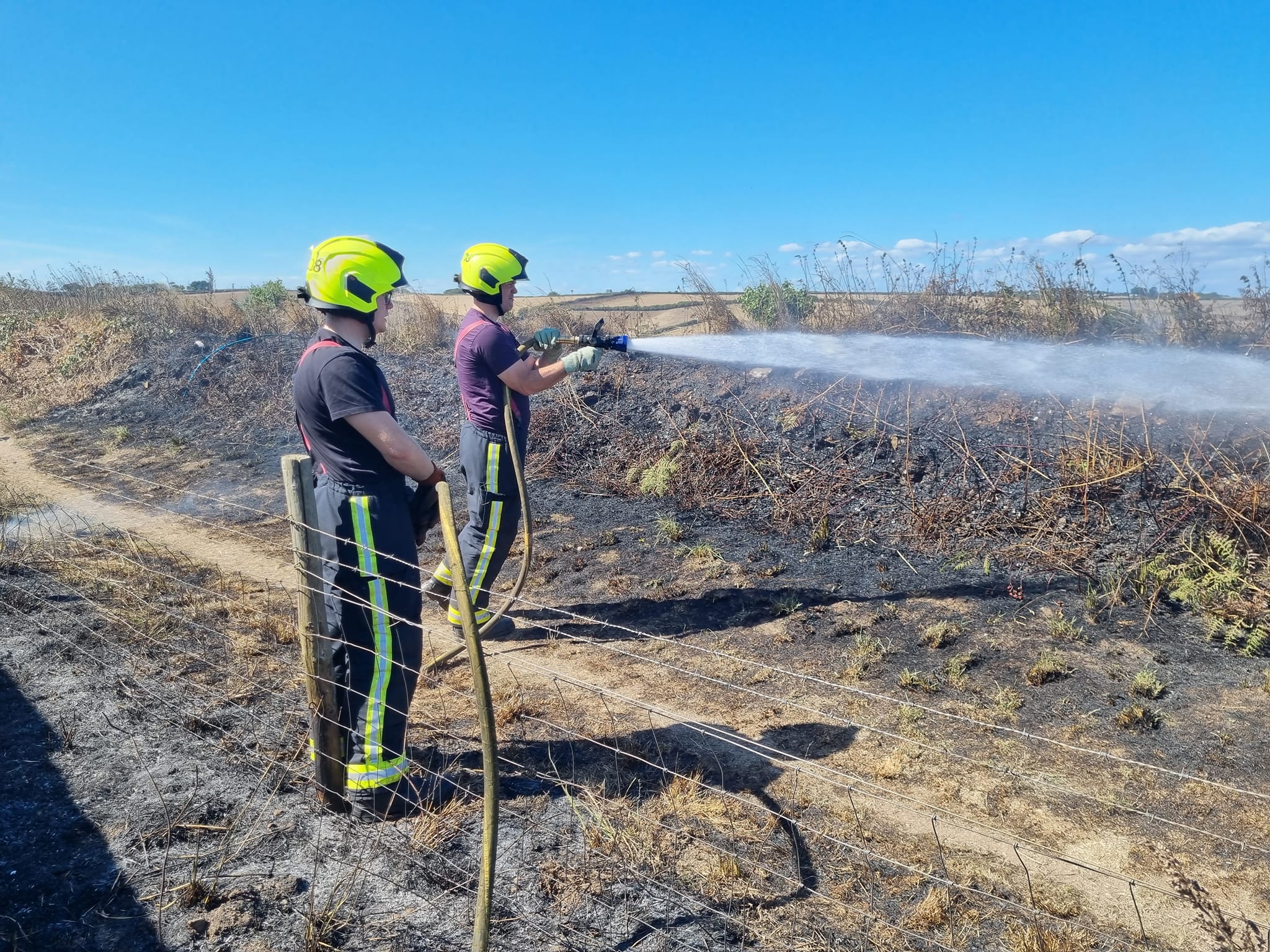 Firefighters battle the coastal blaze near Coleton Fishacre