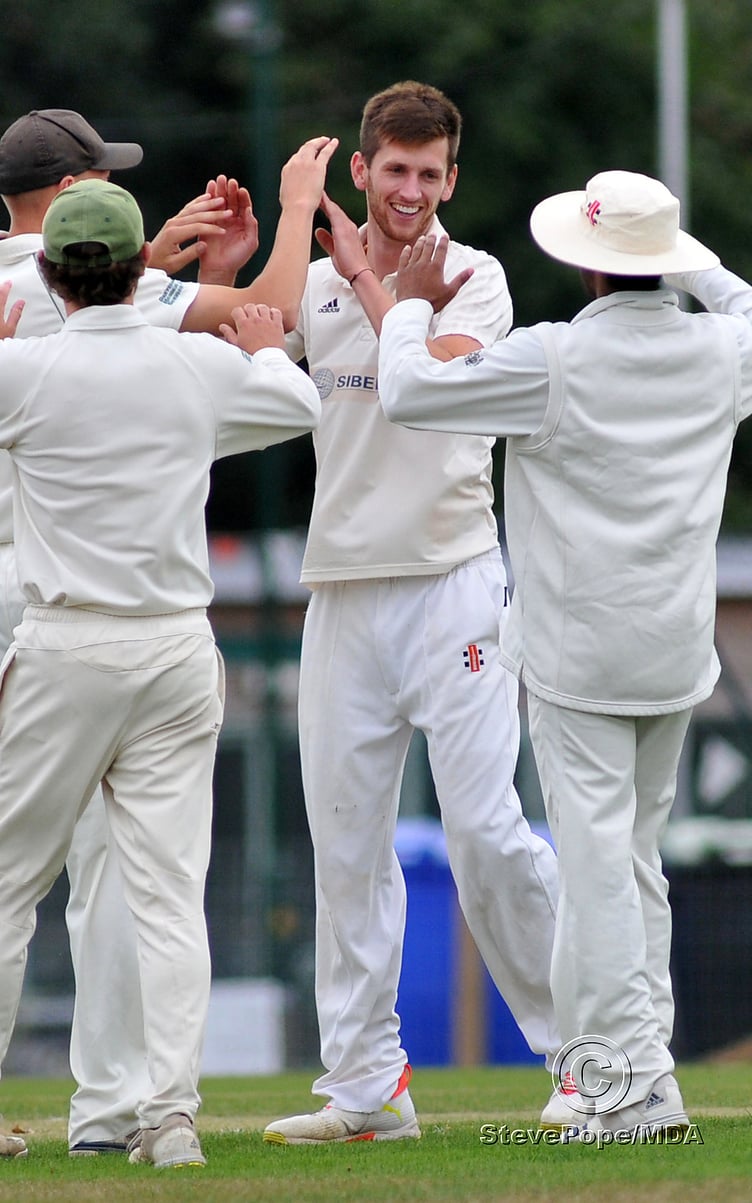Photo: Steve PopeMDA030922G_SP007 Tolchards Devon Cricket League Premier Division. Bovey Tracey versus Paignton. High fives all round for Bovey's bowler Seb Ansley after dismissing Paignton's Harry Ward.