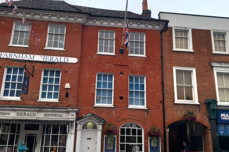 The Union flag is flying at half-mast out of respect for the Queen at the Farnham Herald offices