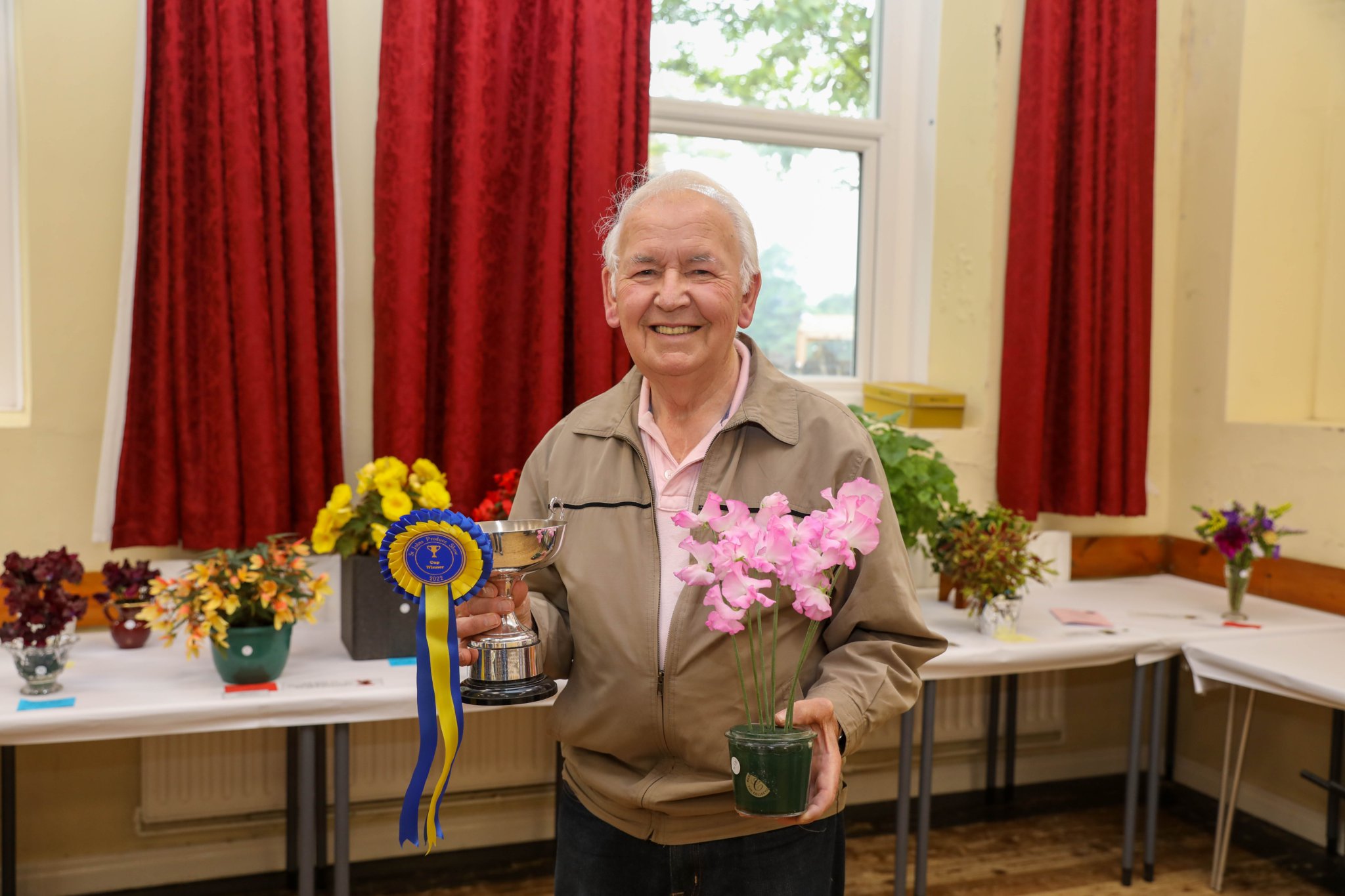 David Creer, with the Jim & Barbara Culshaw Cup for best sweet pea exhibit. St John’s Produce Show 2022. Photo by Callum Staley (CJS Photography).