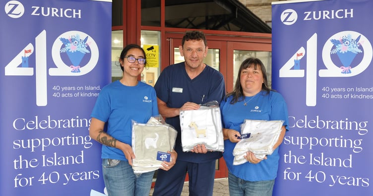 Paul McCann, Lead Nurse at the Neonatal Service, is pictured receiving the blankets from Zurich employees Sara Cryer (left), and Yvette Scales (right).