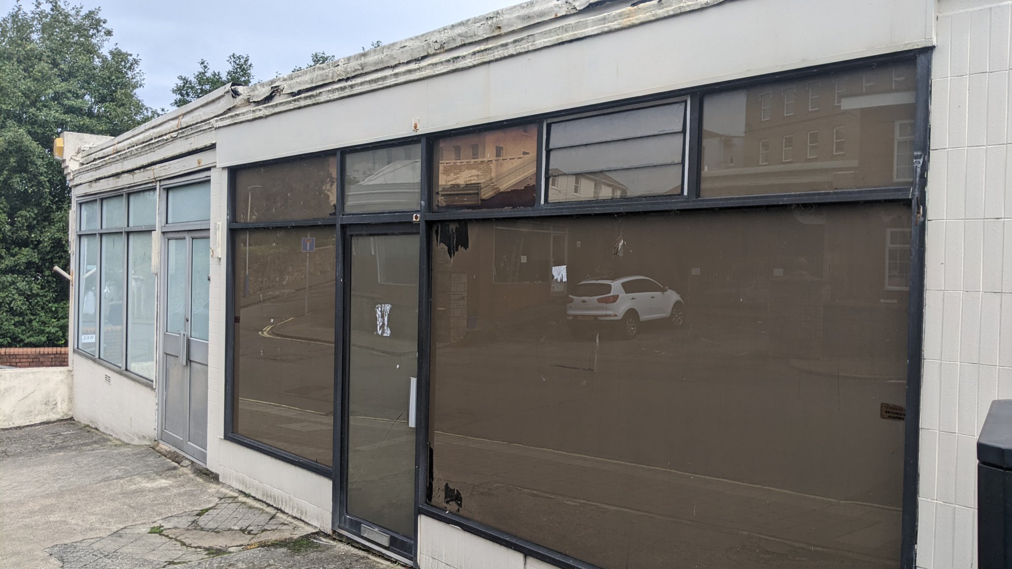 Two of the buildings on the site are fitted with shop fronts