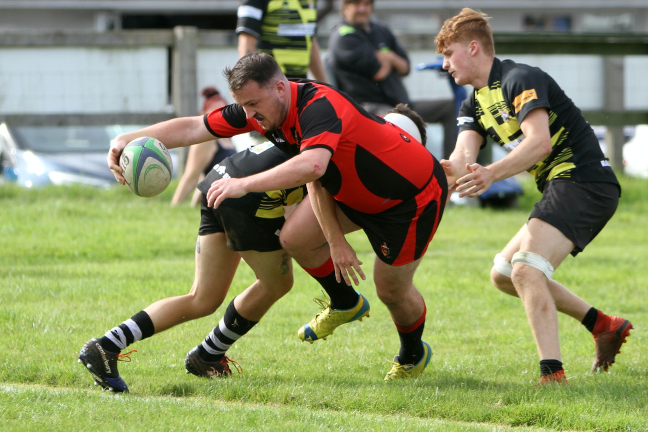 ABOVE: Chris Watts crashes over for a try. ABOVE RIGHT: Liam Mills with a strong carry. BELOW: Ollie Tape with a strong run. BELOW LEFT: Twos captain James Lovering with some fancy footwork.