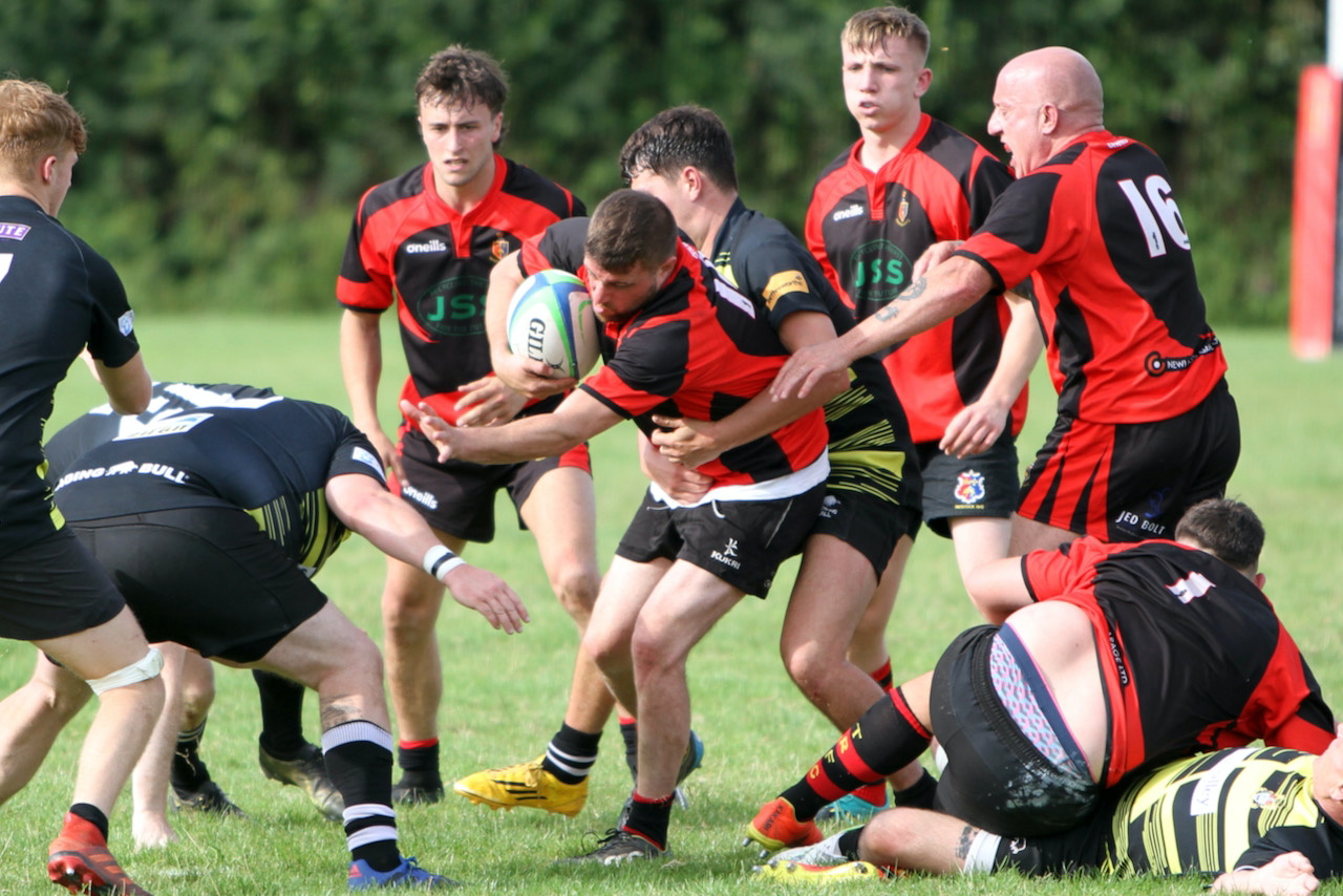 ABOVE: Chris Watts crashes over for a try. ABOVE RIGHT: Liam Mills with a strong carry. BELOW: Ollie Tape with a strong run. BELOW LEFT: Twos captain James Lovering with some fancy footwork.