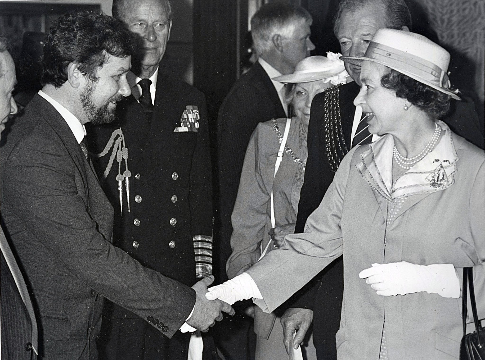 John Baldwin, jeweller, meets the Queen wearing the Armada 400 brooch he designed and made