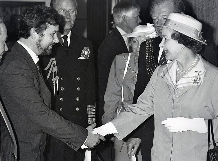 John Baldwin, jeweller, meets the Queen wearing the Armada 400 brooch he designed and made