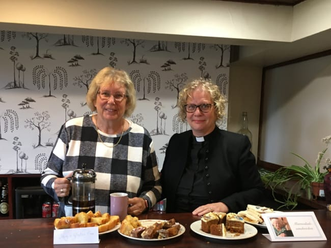 Angela Wheeler and the Rev Fiona Gwynn by cakes at Grayswood Village Club