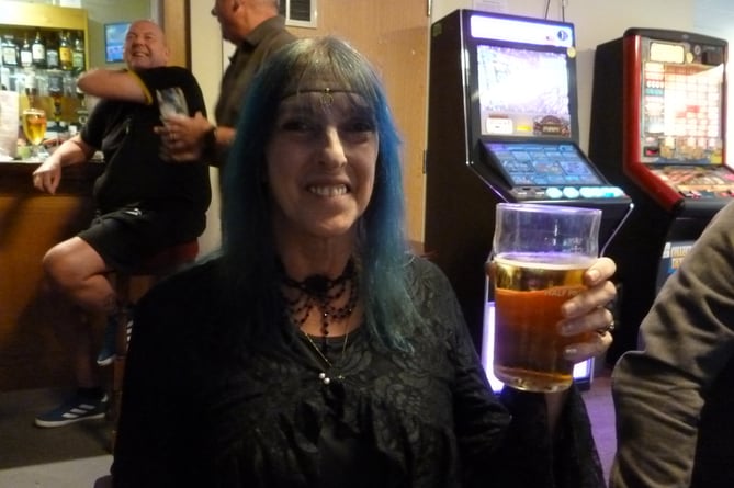 Debz Thompson watching the Queen’s state funeral at Bordon Working Men’s Club on September 19th 2022. 